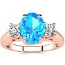 1 3/4 Carat Oval Shape Blue Topaz and Two Diamond Ring In 14 Karat Rose Gold Image-1