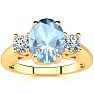 Aquamarine Ring: Aquamarine Jewelry: 1 1/3 Carat Oval Shape Aquamarine and Two Diamond Ring In 14 Karat Yellow Gold Image-1