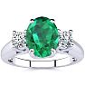 1 1/3 Carat Oval Shape Emerald and Two Diamond Ring In 14 Karat White Gold Image-1
