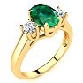 1 1/3 Carat Oval Shape Emerald and Two Diamond Ring In 14 Karat Yellow Gold Image-2