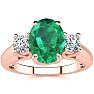1 1/3 Carat Oval Shape Emerald and Two Diamond Ring In 14 Karat Rose Gold Image-1