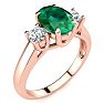 1 1/3 Carat Oval Shape Emerald and Two Diamond Ring In 14 Karat Rose Gold Image-2