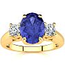 1 1/2 Carat Oval Shape Tanzanite and Two Diamond Ring In 14 Karat Yellow Gold Image-1