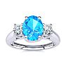 1 1/5 Carat Oval Shape Blue Topaz and Two Diamond Ring In 14 Karat White Gold
 Image-1