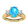 1 1/5 Carat Oval Shape Blue Topaz and Two Diamond Ring In 14 Karat Yellow Gold
 Image-1