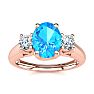 1 1/5 Carat Oval Shape Blue Topaz and Two Diamond Ring In 14 Karat Rose Gold
 Image-1