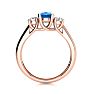 1 1/5 Carat Oval Shape Blue Topaz and Two Diamond Ring In 14 Karat Rose Gold
 Image-3