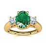1 Carat Oval Shape Emerald and Two Diamond Ring In 14 Karat Yellow Gold Image-1