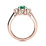 1 Carat Oval Shape Emerald and Two Diamond Ring In 14 Karat Rose Gold Image-3