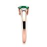 1 Carat Oval Shape Emerald and Two Diamond Ring In 14 Karat Rose Gold Image-4