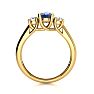 1.15 Carat Oval Shape Tanzanite and Two Diamond Ring In 14 Karat Yellow Gold Image-3