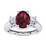 Garnet Ring: Garnet Jewelry: 1 1/5 Carat Oval Shape Garnet and Two Diamond Ring In 14 Karat White Gold Image-1