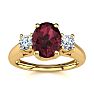 Garnet Ring: Garnet Jewelry: 1 1/5 Carat Oval Shape Garnet and Two Diamond Ring In 14 Karat Yellow Gold Image-1