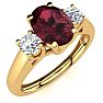 Garnet Ring: Garnet Jewelry: 1 1/5 Carat Oval Shape Garnet and Two Diamond Ring In 14 Karat Yellow Gold Image-2