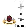 Garnet Ring: Garnet Jewelry: 1 1/5 Carat Oval Shape Garnet and Two Diamond Ring In 14 Karat Yellow Gold Image-5