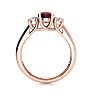 Garnet Ring: Garnet Jewelry: 1 1/5 Carat Oval Shape Garnet and Two Diamond Ring In 14 Karat Rose Gold Image-3