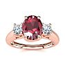 1.15 Carat Oval Shape Ruby and Two Diamond Ring In 14 Karat Rose Gold