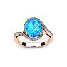 1 1/4 Carat Oval Shape Blue Topaz and Halo Diamond Ring In 14 Karat Rose Gold Image-1
