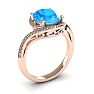1 1/4 Carat Oval Shape Blue Topaz and Halo Diamond Ring In 14 Karat Rose Gold Image-2