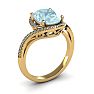 Aquamarine Ring: Aquamarine Jewelry: 1 1/3 Carat Oval Shape Aquamarine and Halo Diamond Ring In 14 Karat Yellow Gold Image-2