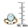 Aquamarine Ring: Aquamarine Jewelry: 1 1/3 Carat Oval Shape Aquamarine and Halo Diamond Ring In 14 Karat Yellow Gold Image-5