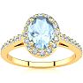 Aquamarine Ring: Aquamarine Jewelry: 1 Carat Oval Shape Aquamarine and Halo Diamond Ring In 14 Karat Yellow Gold Image-1