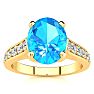 2 1/2 Carat Oval Shape Blue Topaz and Diamond Ring In 14 Karat Yellow Gold Image-1