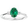 1 1/4 Carat Oval Shape Emerald and Two Diamond Ring In 14 Karat White Gold Image-1