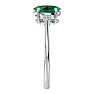 1 1/4 Carat Oval Shape Emerald and Two Diamond Ring In 14 Karat White Gold Image-4