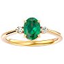 1 1/4 Carat Oval Shape Emerald and Two Diamond Ring In 14 Karat Yellow Gold Image-1