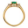 1 1/4 Carat Oval Shape Emerald and Two Diamond Ring In 14 Karat Yellow Gold Image-3