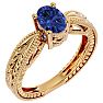 1 1/3 Carat Oval Shape Tanzanite Ring With Tapered Etched Band In 14 Karat Yellow Gold Image-2