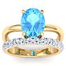 3 3/4 Carat Oval Shape Blue Topaz and Halo Diamond Ring Plus Band In 14 Karat Yellow Gold Image-1