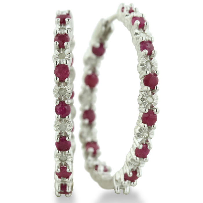 Hoop earrings will always be in style!  Be sure to grab these fabulous ruby and diamond hoop earrings.  Each earring has 12 ruby stones and are set in sterling silver.  Dangling at about 1 inches down, they are perfect for everyone.  Total gem weight is 1.5 carats.  Diamond content is .01 carats, diamond color is J-K and diamond clarity is I2-I3.