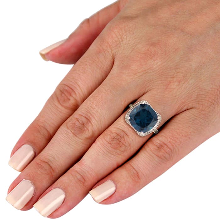 For a trendy statement ring, try this huge sapphire and diamond right hand ring.  Total gem weight is 7 carats and diamond content is .03 carats in J/K color, I3 clarity.
