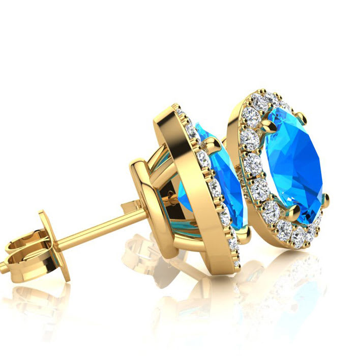 3 1/4 Carat Oval Shape Blue Topaz and Halo Diamond Stud Earrings In 14 Karat Yellow Gold