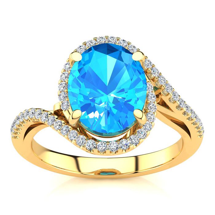 3 1/2 Carat Oval Shape Blue Topaz and Halo Diamond Ring In 14 Karat Yellow Gold