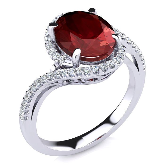 3 1/3 Carat Oval Shape Ruby and Halo Diamond Ring In 14 Karat White Gold