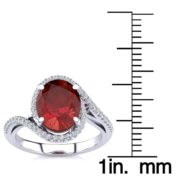 3 1/3 Carat Oval Shape Ruby and Halo Diamond Ring In 14 Karat White Gold