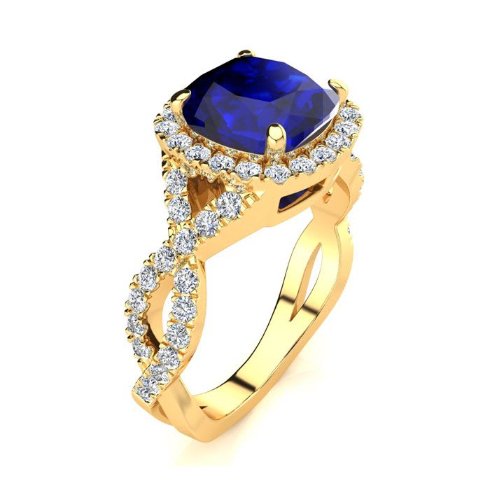 3 1/2 Carat Cushion Cut Sapphire and Halo Diamond Ring With Fancy Band In 14 Karat Yellow Gold