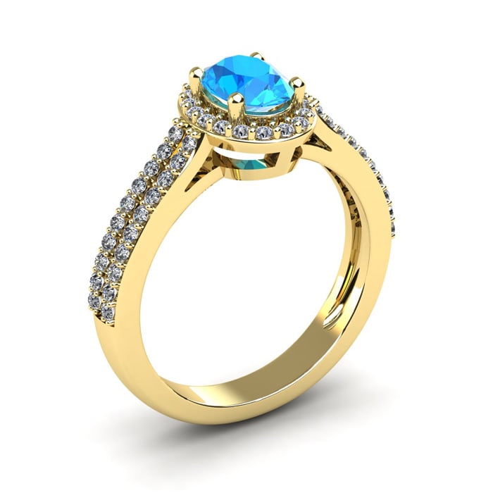 1 1/2 Carat Oval Shape Blue Topaz and Halo Diamond Ring In 14 Karat Yellow Gold