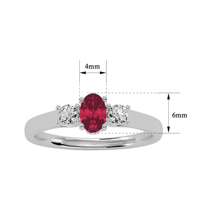 3/4 Carat Oval Shape Ruby and Two Diamond Ring In 14 Karat White Gold