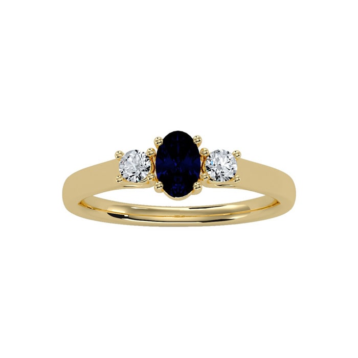 3/4 Carat Oval Shape Sapphire and Two Diamond Ring In 14 Karat Yellow Gold