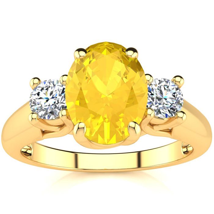 1 1/4 Carat Oval Shape Citrine and Two Diamond Ring In 14 Karat Yellow Gold