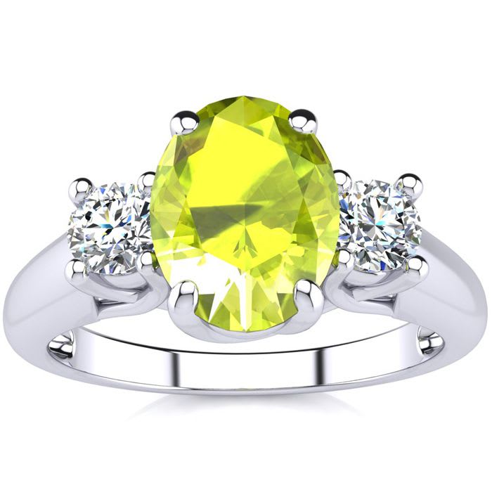 1 1/2 Carat Oval Shape Peridot and Two Diamond Ring In 14 Karat White Gold