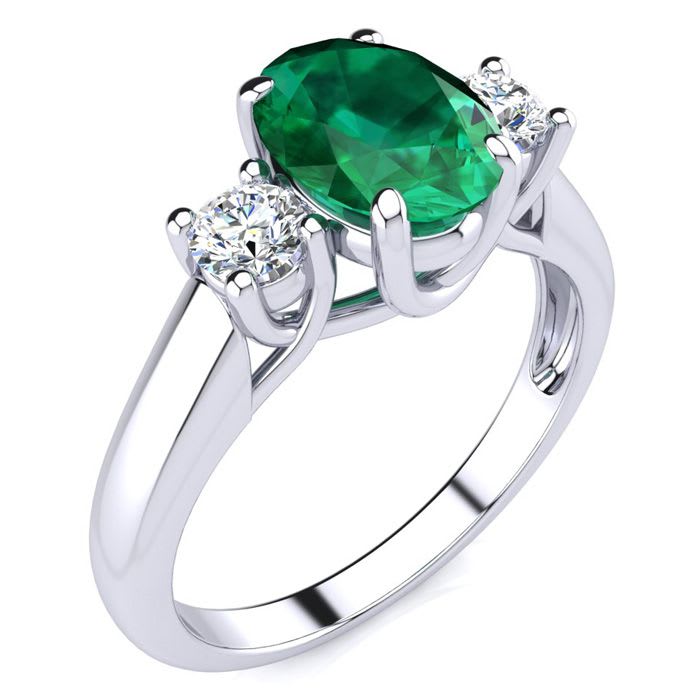 1 1/3 Carat Oval Shape Emerald and Two Diamond Ring In 14 Karat White Gold