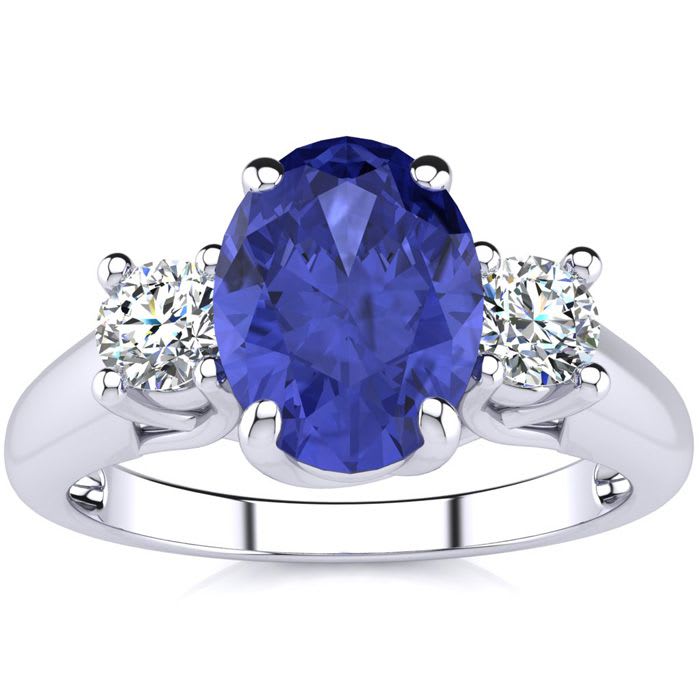 1 1/2 Carat Oval Shape Tanzanite and Two Diamond Ring In 14 Karat White Gold