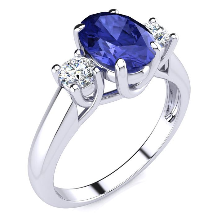 1 1/2 Carat Oval Shape Tanzanite and Two Diamond Ring In 14 Karat White Gold