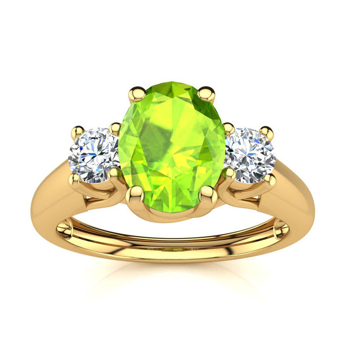 1 Carat Oval Shape Peridot and Two Diamond Ring In 14 Karat Yellow Gold