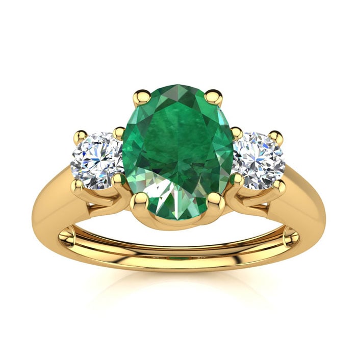 1 Carat Oval Shape Emerald and Two Diamond Ring In 14 Karat Yellow Gold